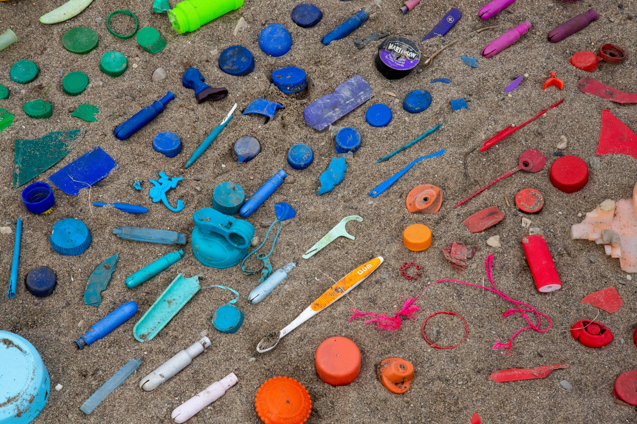 Colourful plastic pieces on beach