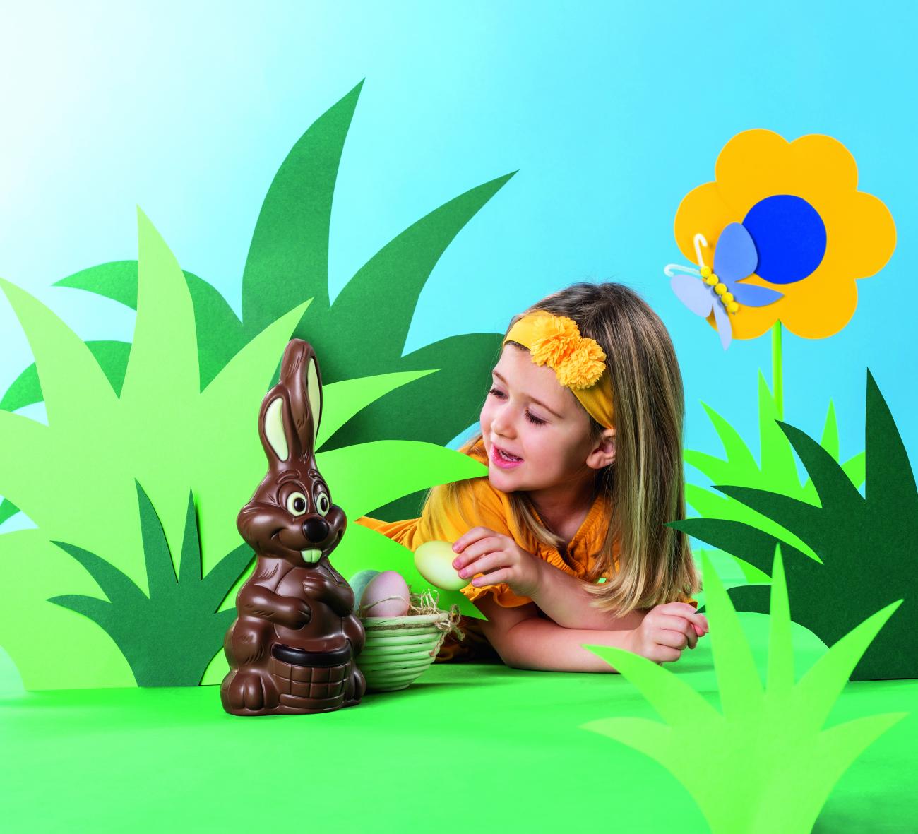 Little girl with Easter chocolate bunny