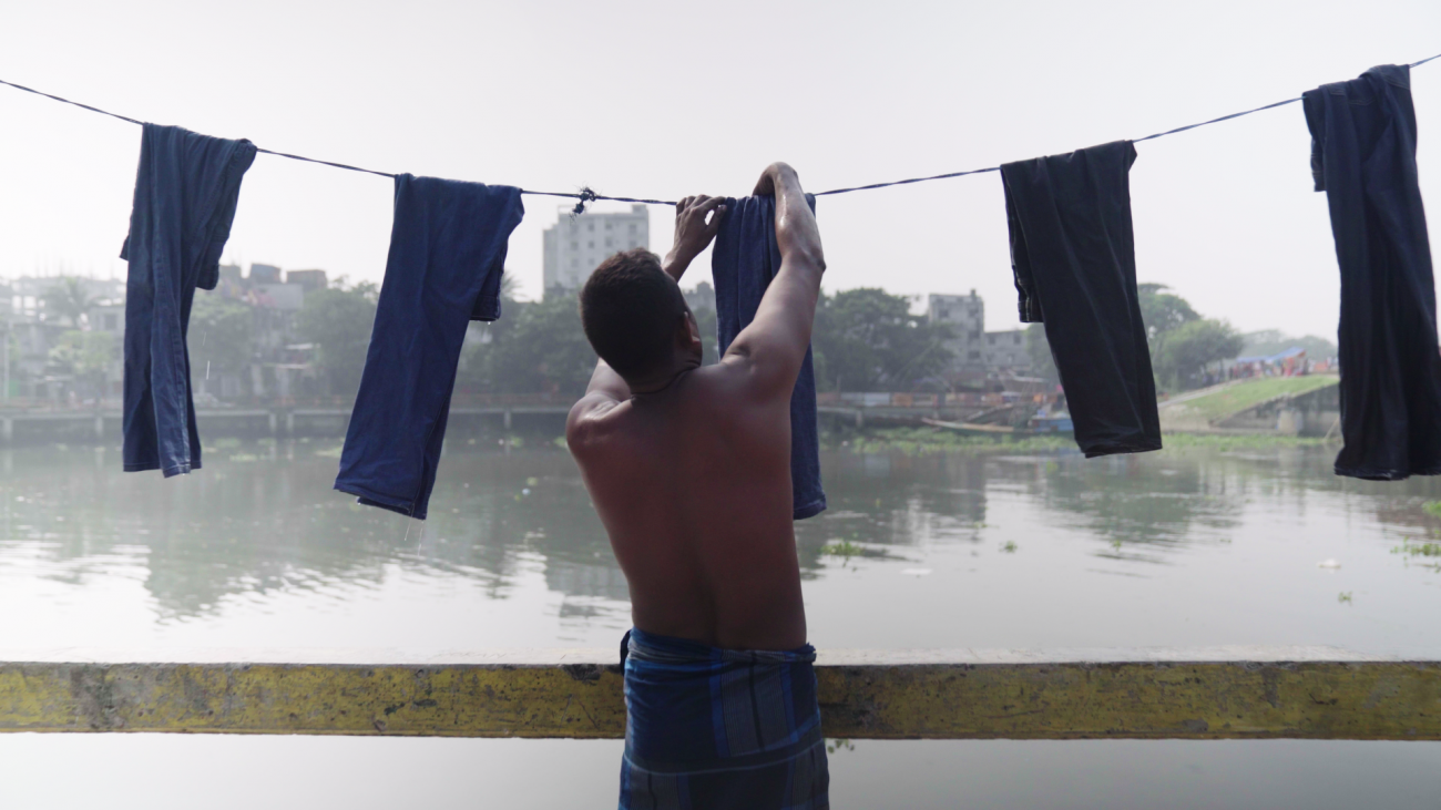 Man hanging clothes to dry