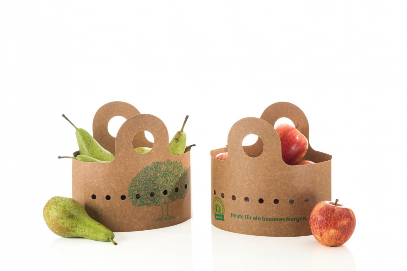 Apple and pear in cardboard packaging