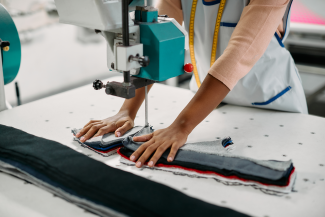 Person cutting textile